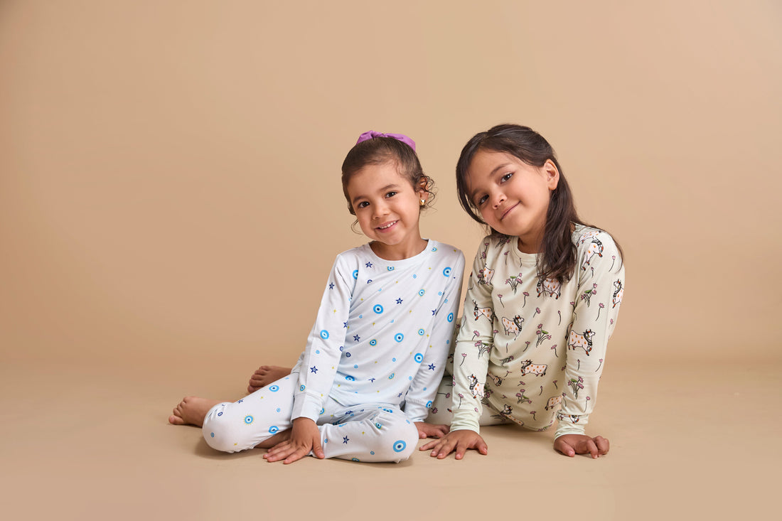 Baby wearing bamboo pajamas with South Asian-inspired prints