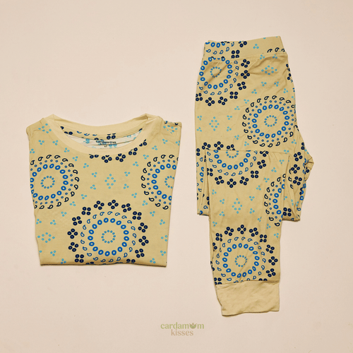 Bandhani Burst toddler pajama set with tie-dye inspired print on a beige background