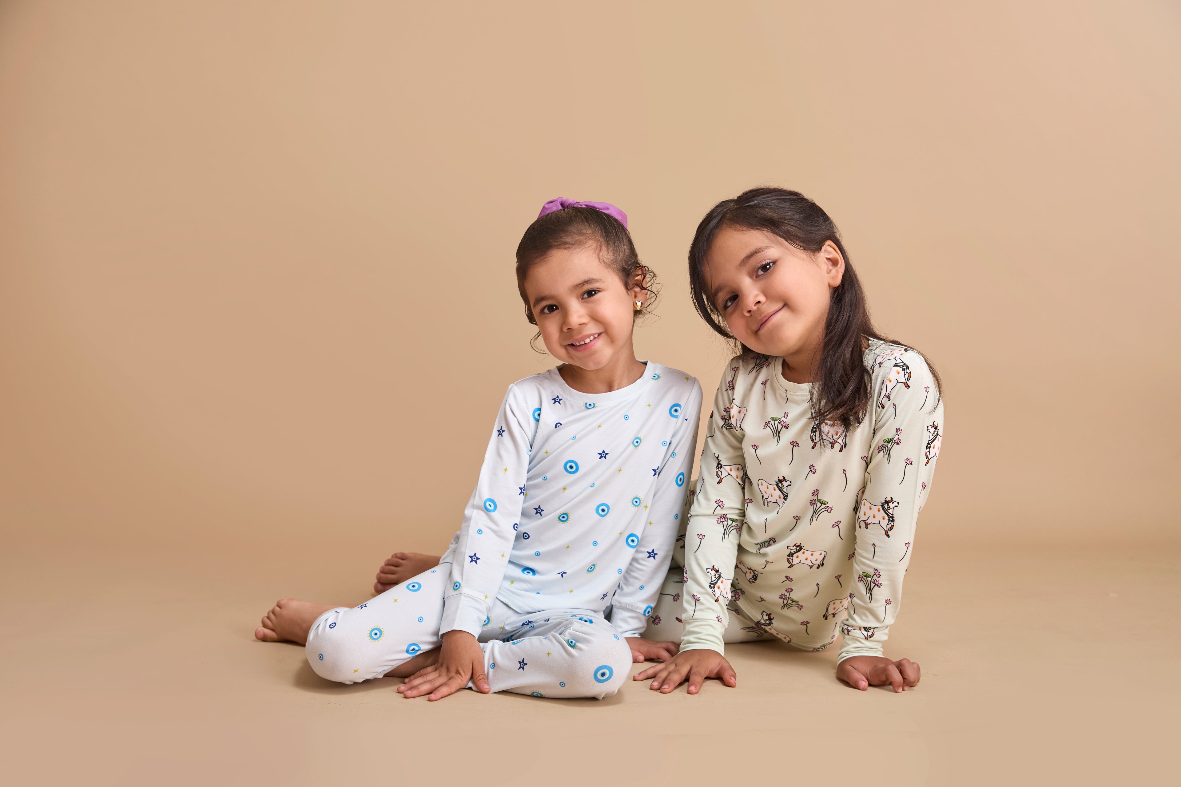 Toddler wearing a Cardamom Kisses bamboo pajama set, part of the build-your-own toddler bundle